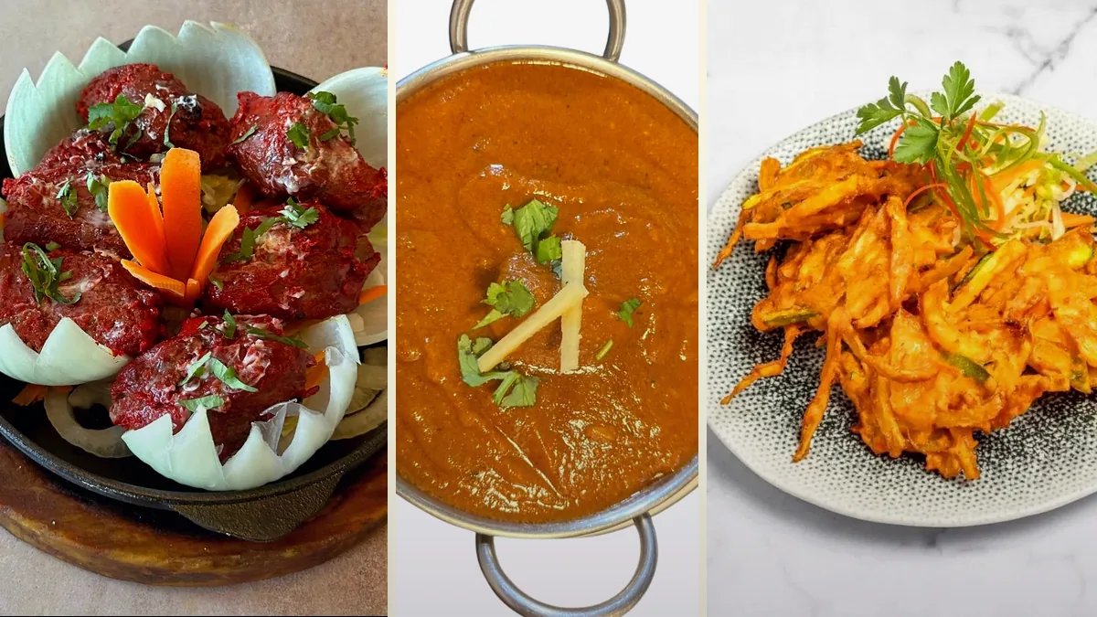 Entrantes y platos de cocina india preparados para compartir en una mesa